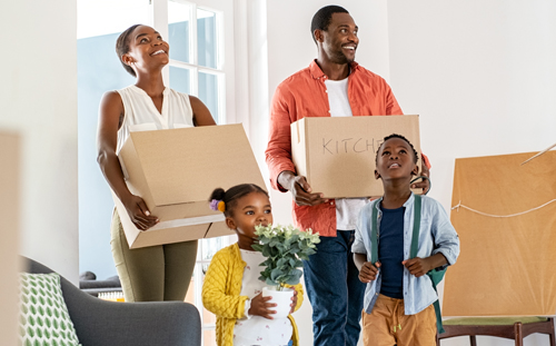 Happy family moving into a house with a VA Loan